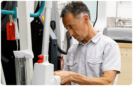 rocky bay equipment technician works on a piece of rocky bay disability equipment.