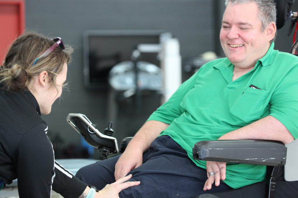 a rocky bay client receives treatment on his knee by a rocky bay physiotherapist.