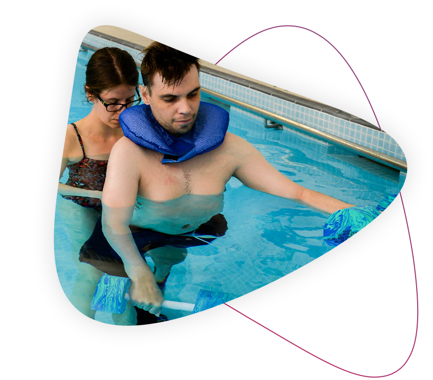 a rocky bay customer is receiving physiotherapy treatment in a pool with a physiotherapist.