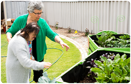 Two woman working in the garden together