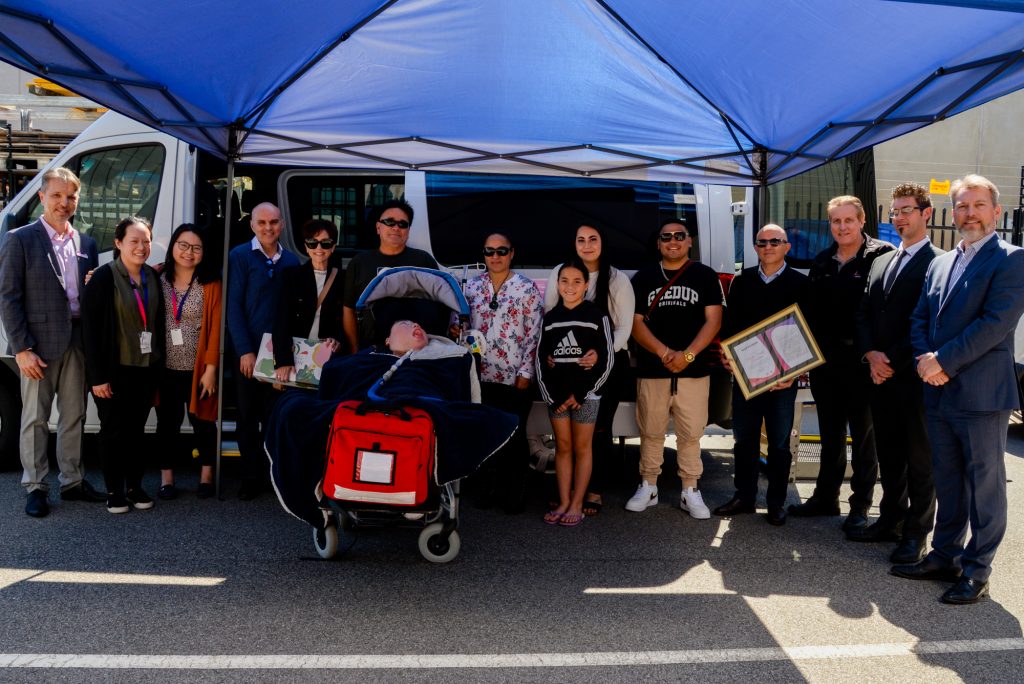 Carcione and Ngamoki-Stevens family with representatives from NDIS, Omnibus Transit and Mercedes