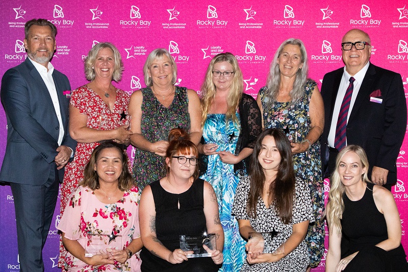 Group photo of Rocky Bay's 2021 Star Award winners. On far left is CEO Michael Tait and far right Chairperson Trent Bartlett