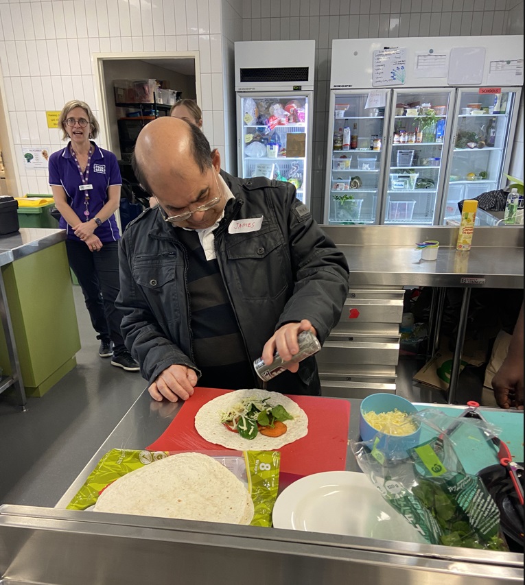 Rocky Bay customer cooking a meal at Food Bank in a healthy eating program