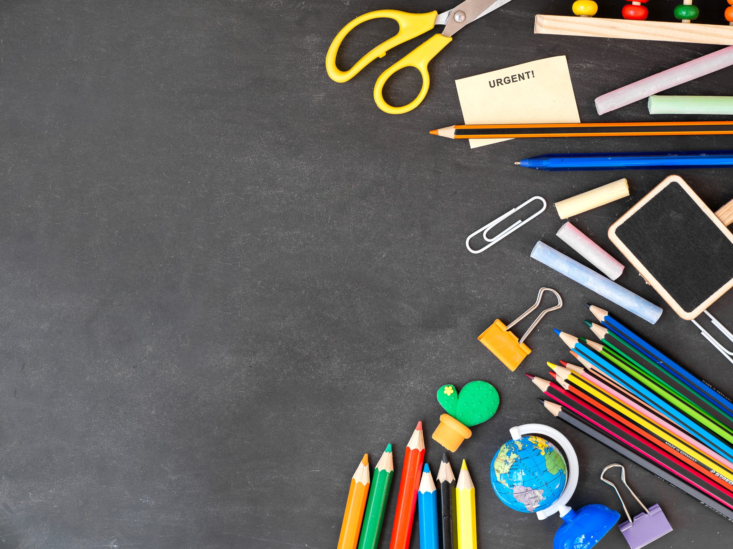 The image is a stock image of stationary items laid out on a desk.