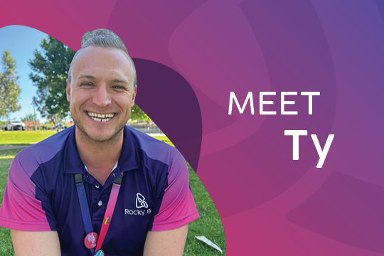 Photo of Rocky Bay Physiotherapist Ty Kowalski smiling at the camera. The image includes the text 'Meet Ty' in white.