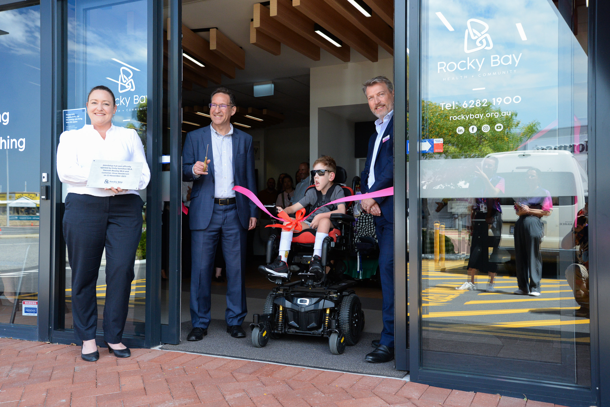 Emily Hamilton MLA Member for Joondalup, Rocky Bay Deputy Chair Paul Klein, Rocky Bay customer Knox and CEO Michael Tait officially open the Joondalup Hub by getting the ribbon.