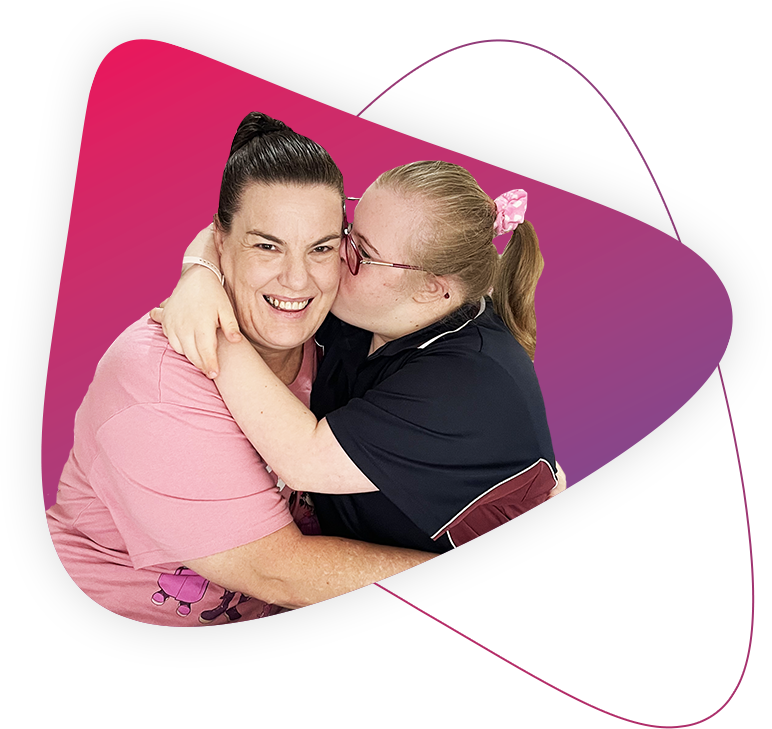 Pictured right is Rocky Bay customer Lileigh and pictured left is Mum Bec. Lileigh is kissing Mum Bec on her cheek.