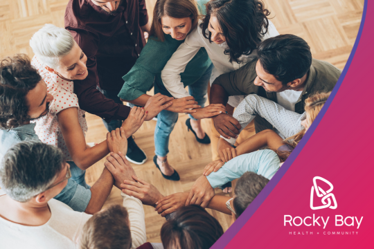 Armadale let's connect expo. Image shows a diverse group of people creating a circle by holding the next person's arm.