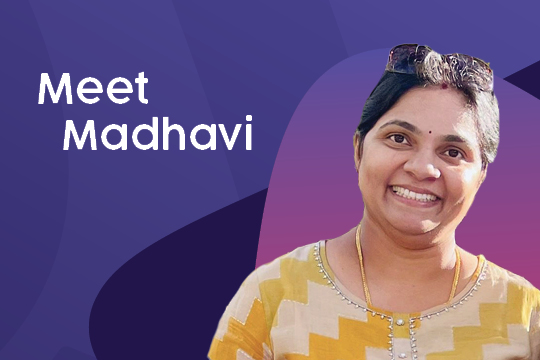 A photo of Rocky Bay Community Nurse Madhavi, she is smiling at the camera. Her image is placed a top of pink and purple background, with white text in the top left corner and says 'Meet Madhavi.'