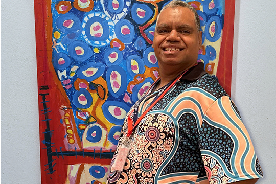 Rocky Bay customer Darryl stands proudly in front of his artwork 'Snake Nest.'